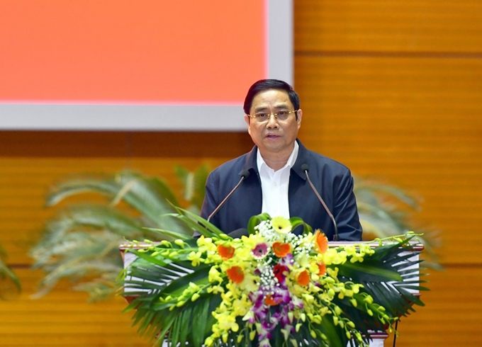 Đồng chí Phạm Minh Chính, Ủy viên Bộ Chính trị, Bí thư Trung ương Đảng, Trưởng Ban Tổ chức Trung ương trình bày báo cáo tổng kết công tác tổ chức Đại hội đảng bộ các cấp nhiệm kỳ 2020- 2025.