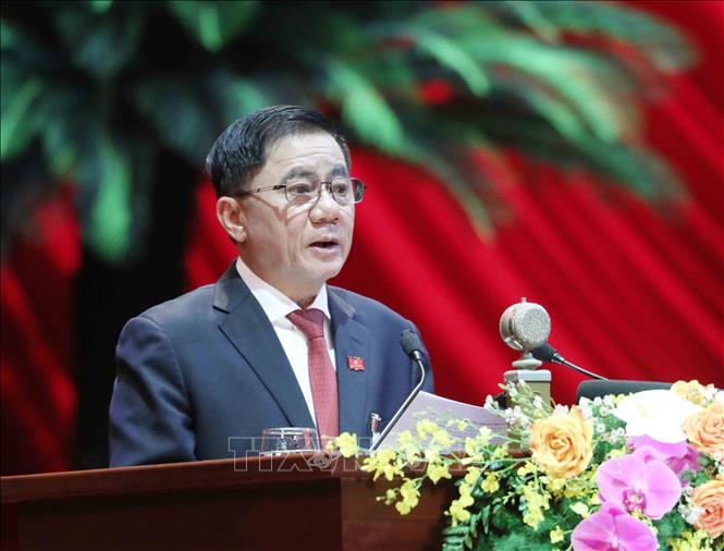 Ông Lê Minh Hưng, Ủy viên Trung ương Đảng, Chánh Văn phòng Trung ương Đảng báo cáo Chương trình làm việc của Đại hội.